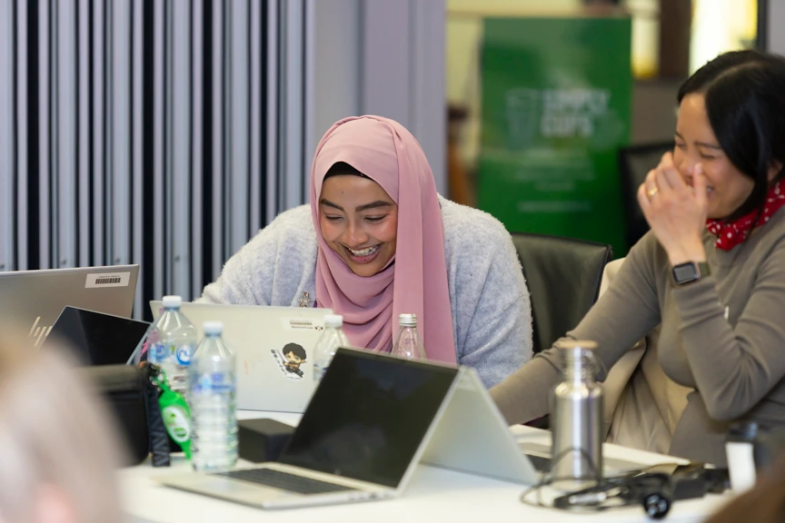 Attendees giggling at a workshop at Telstra Melbourne